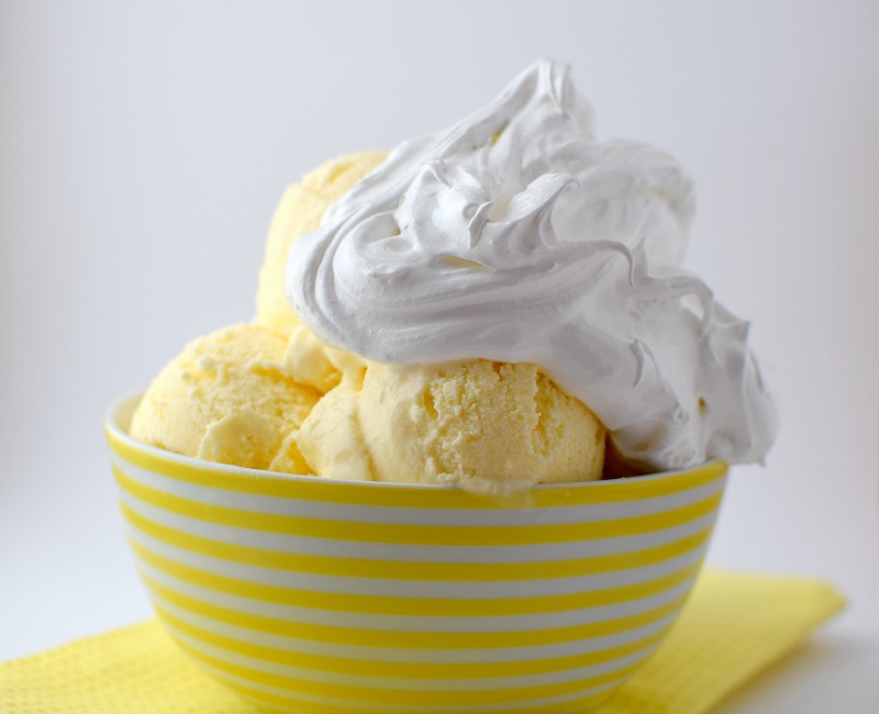 Lemon ice cream in bowl with meringue
