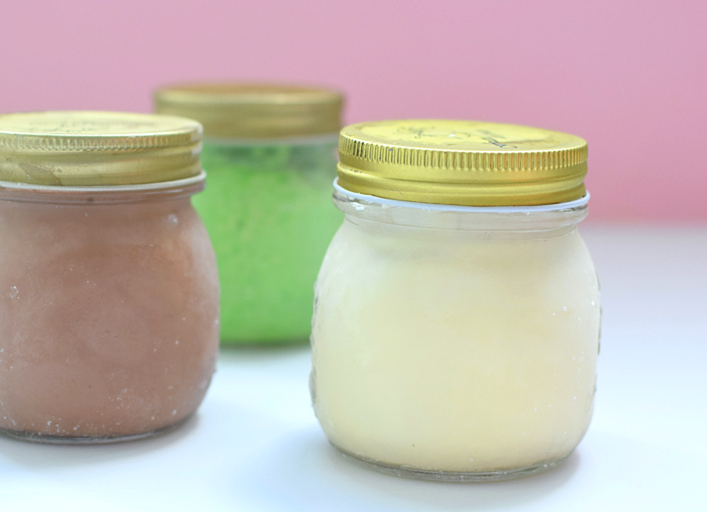 Three jars of ice cream: mint, chocolate and vanilla.