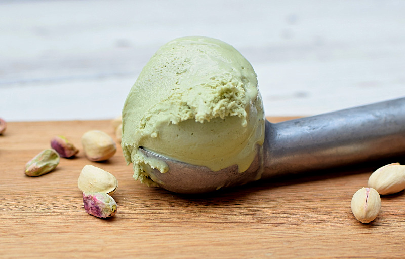 Pistachio ice cream in a scoop