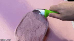 Scooping strawberry ice cream