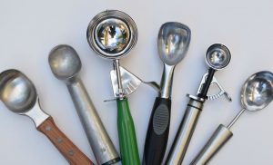 A selection of ice cream scoops on a kitchen bench