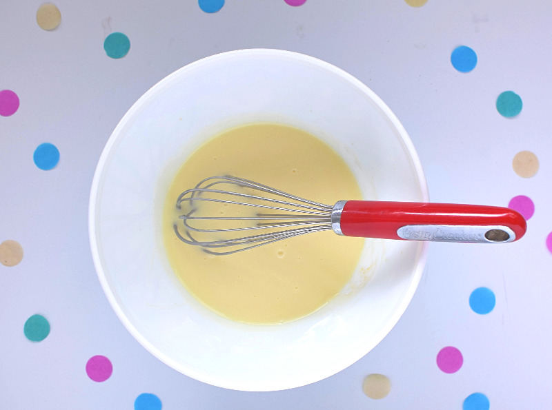 A bowl of condensed milk and vanilla