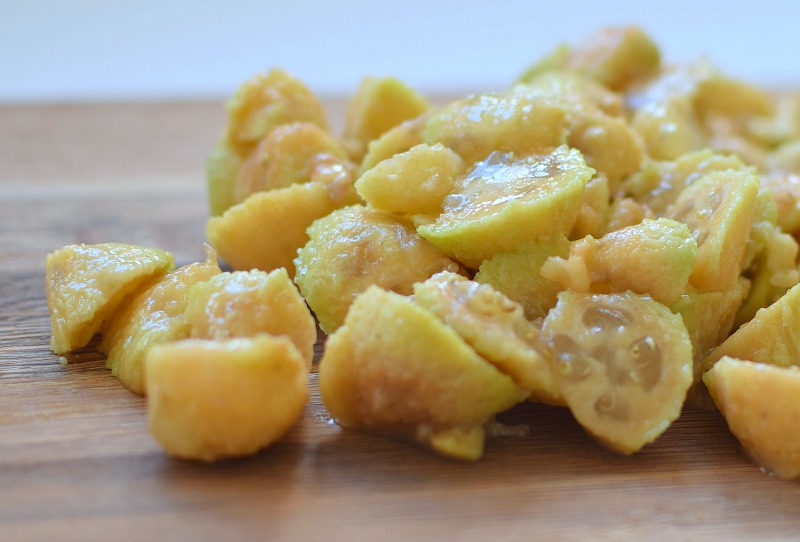 Chopped feijoas on chopping board ready to blend