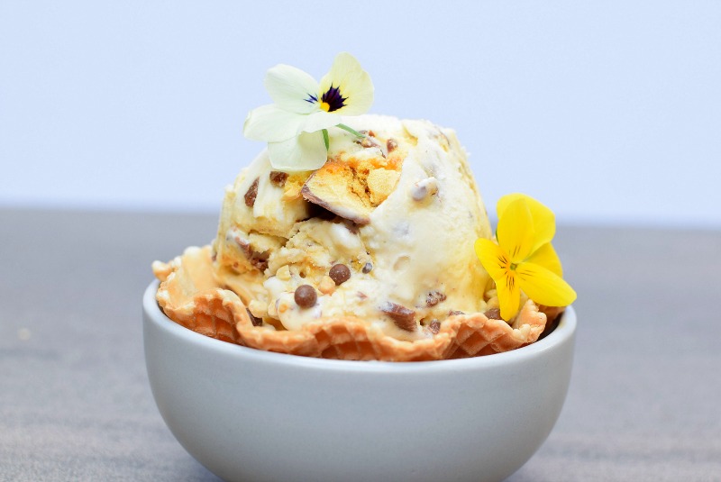 Crunchie ice cream garnished with flowers.