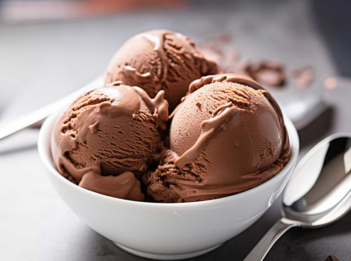 Scoops of homemade chocolate ice cream in a white bowl.
