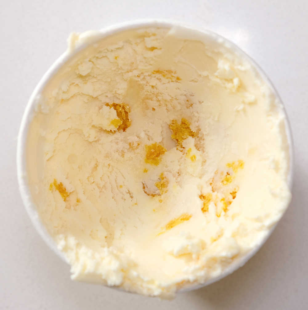 Looking into a partly consumed tub of yuzu lemon ice cream.