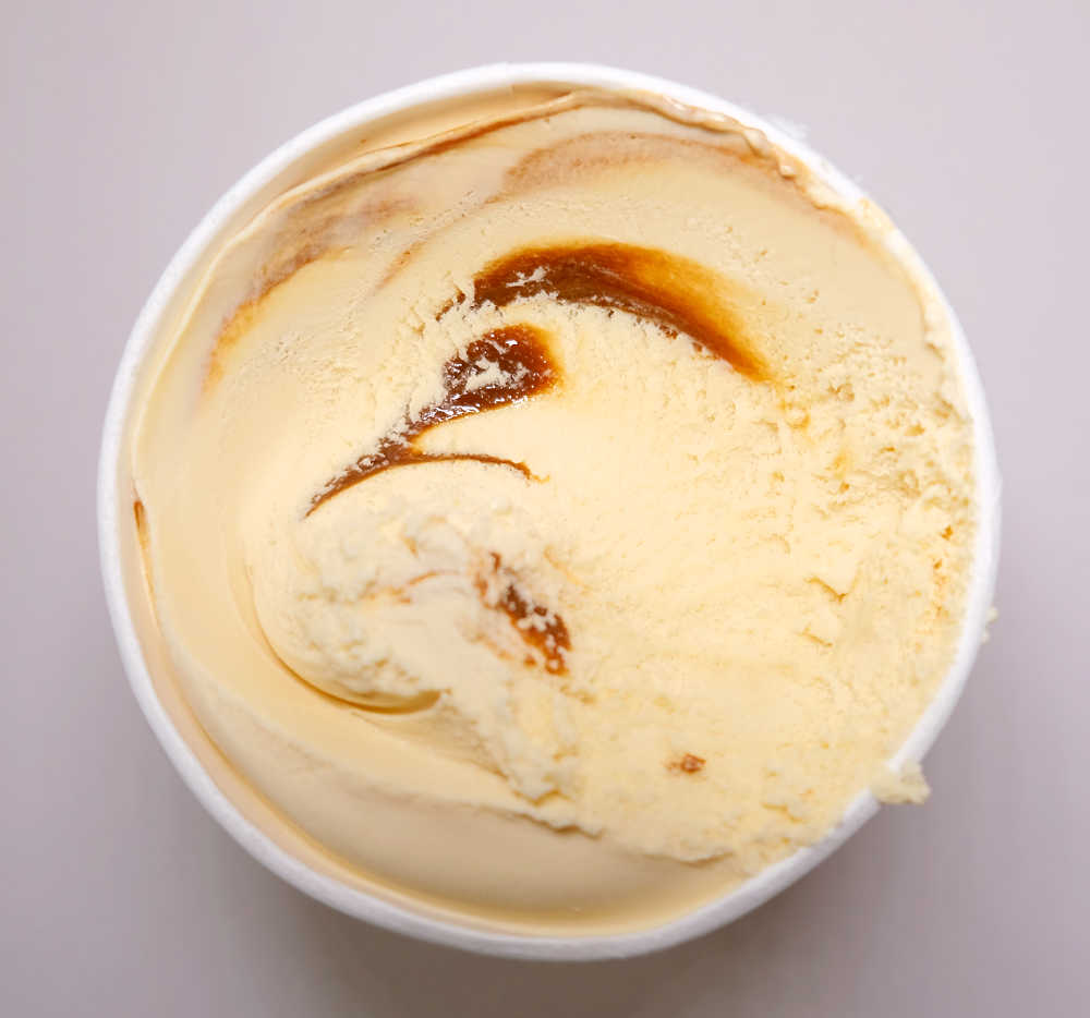 A partly eaten container of Banoffee Ice Cream.
