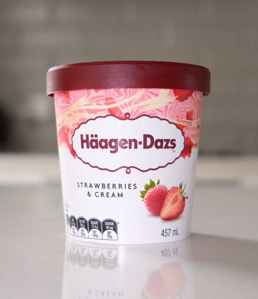 A vertical shot of the ice cream tub.