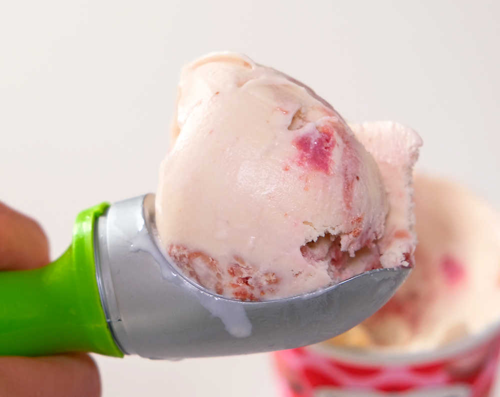 A closeup photograph of a scoop of Dazs Macaron ice cream.