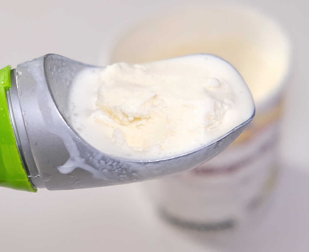A scoop of melting vanilla ice cream.