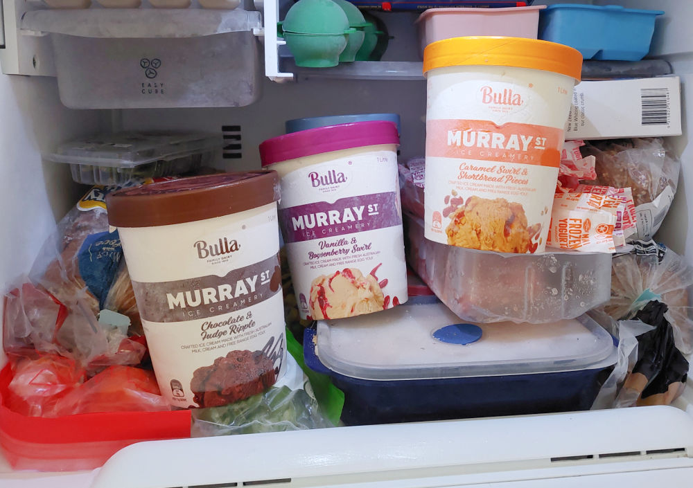 A freezer packed with a range of Bulla Murray St Ice Cream tubs.