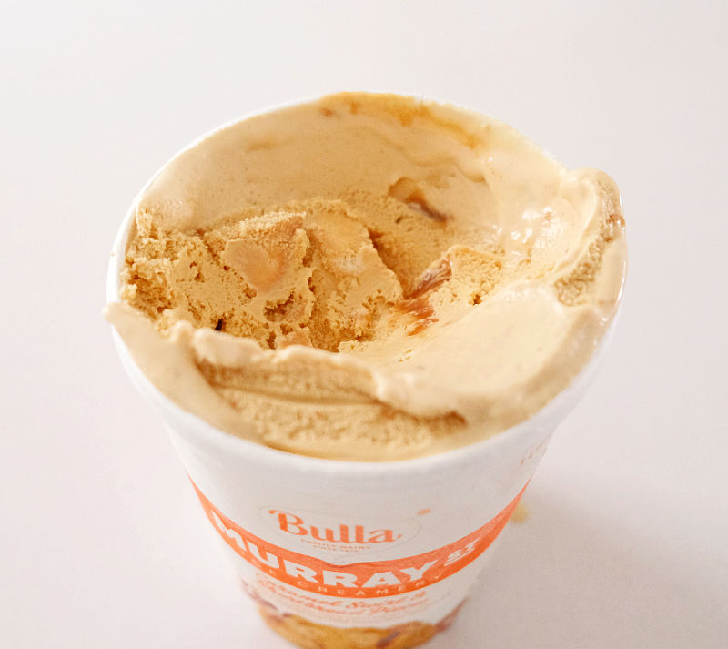 An image showing some caramel sauce and bits of shortbread in the ice cream.