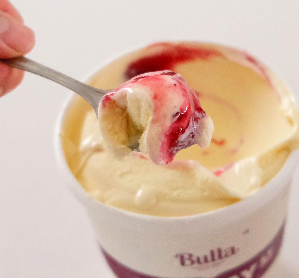A small spoonful of boysenberry vanilla ice cream made by Murray St Creamery.