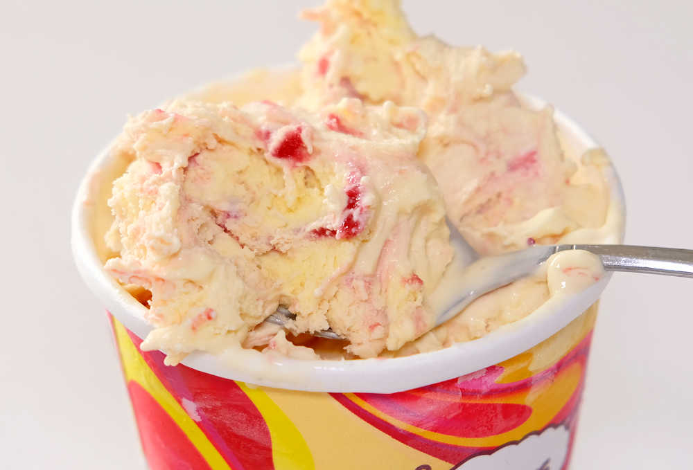 Zoomed in shot of Haagen Dazs Mango Raspberry ice cream that has had time to soften.