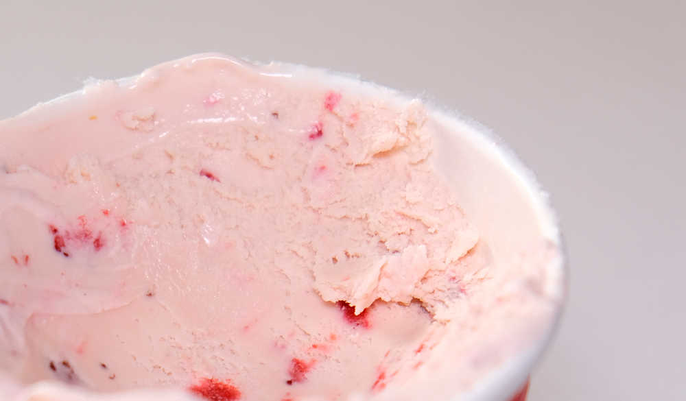 A closeup image of Haagen-Dazs Strawberry-Cream Ice Cream.