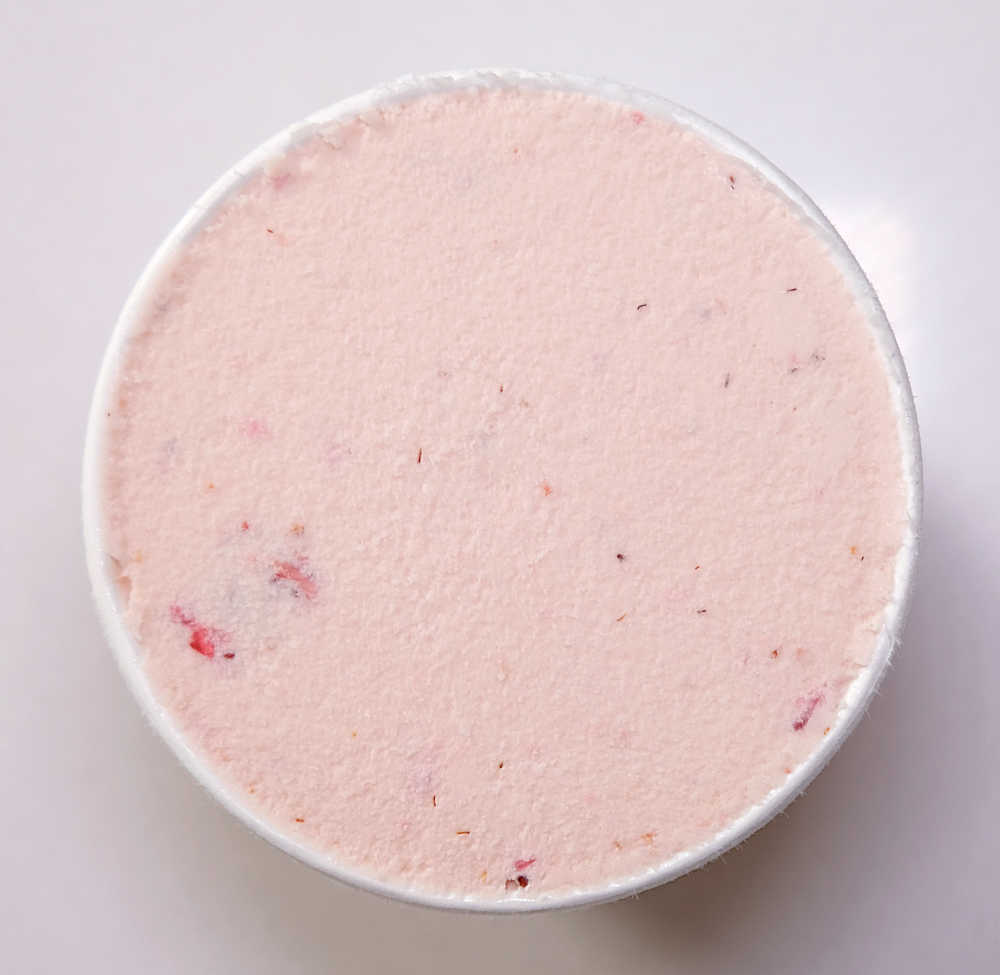 A top-down image of Haagen-Dazs ice cream strawberry cream before scooping it.