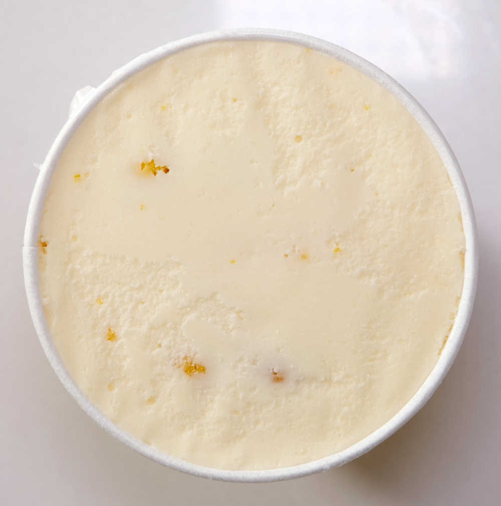 A top-down image of an opened pint of Haagen-Dazs Yuzu and Lemon Ice Cream