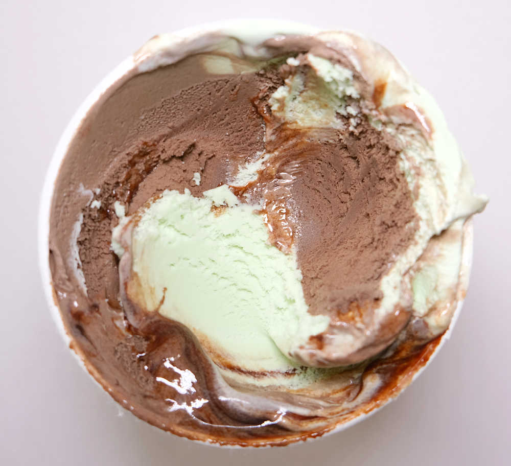 Bird's eye view of a partly eaten one-litre pack of Bulla Choc Mint Sundae Ice Cream.