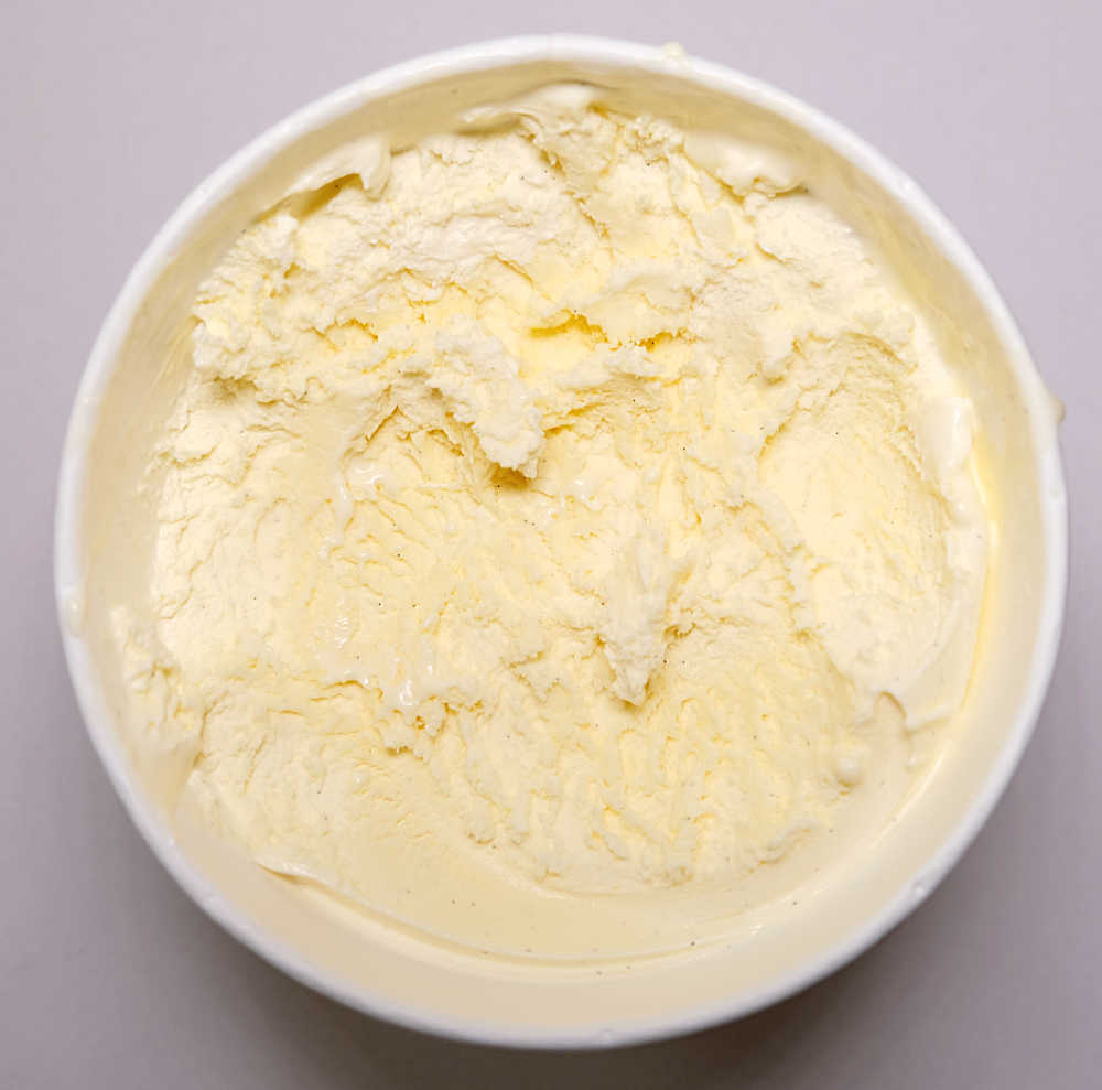 Top down photograph of a partly eaten tub of Kapiti Vanilla Bean.