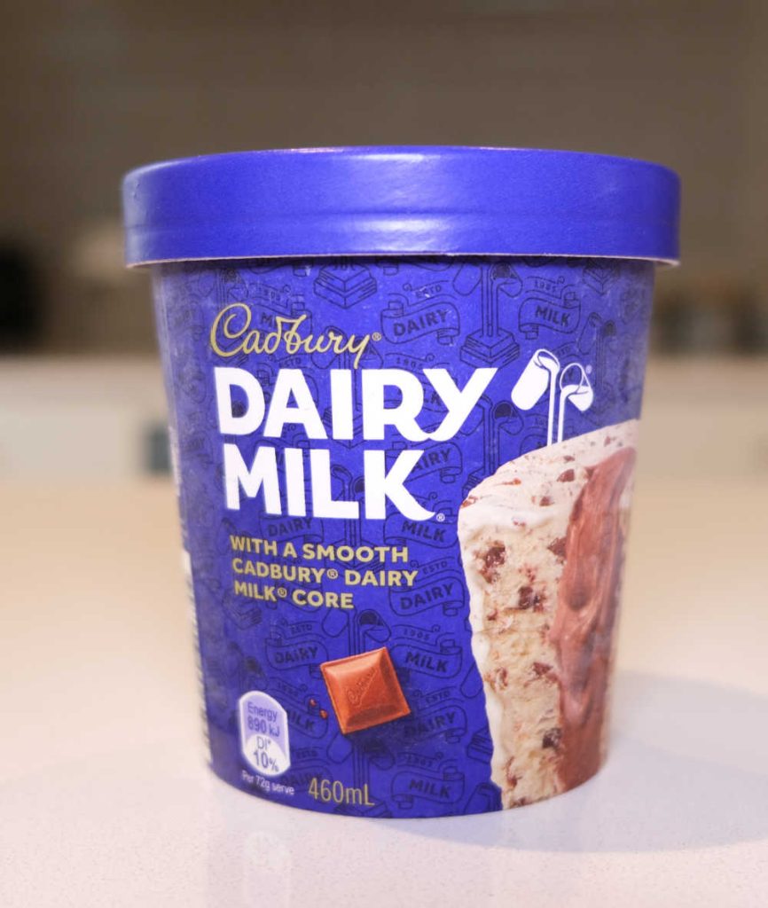 A vertical pack shot of Dairy Milk on a kitchen countertop.