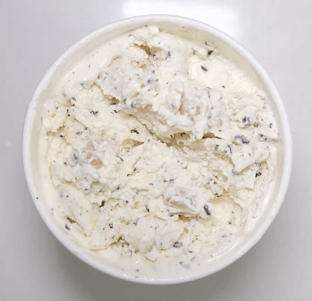 Top down photo showing the texture of Woolworths Cookie Dough Choc Flakes Ice Cream.