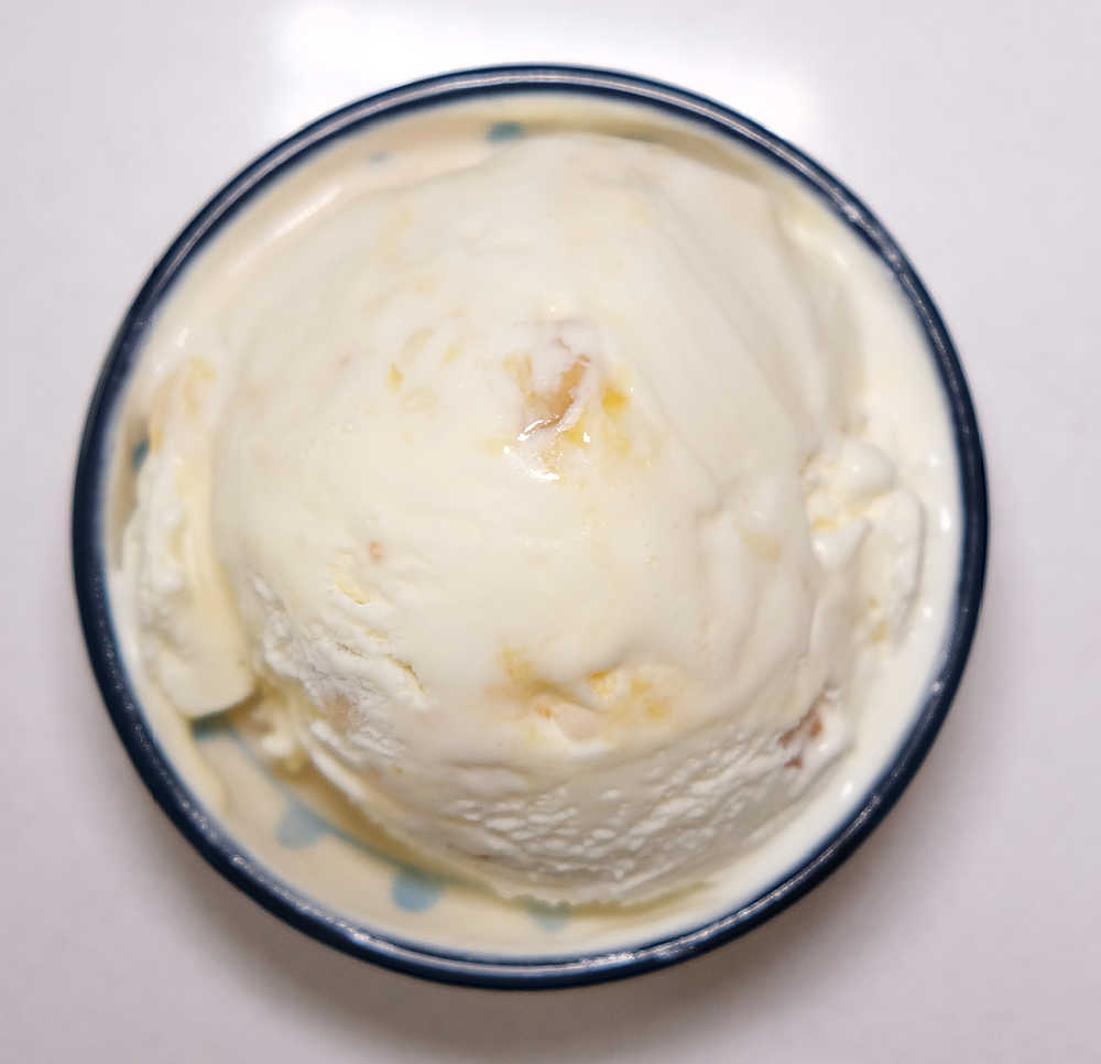 Bird's eye view of White Choc Macadamia Mango Ripple in a small bowl.