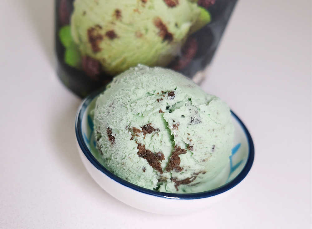 A bowl full of Indulge Mint and Cookies on an isolated white background.