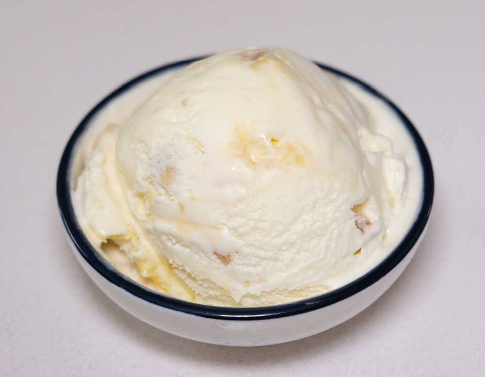 A bowl of WOW White Choc Macadamia Mango Ripple.