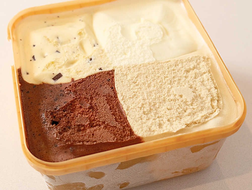 An opened pack of Much Moore Cravings Ice cream 2L.