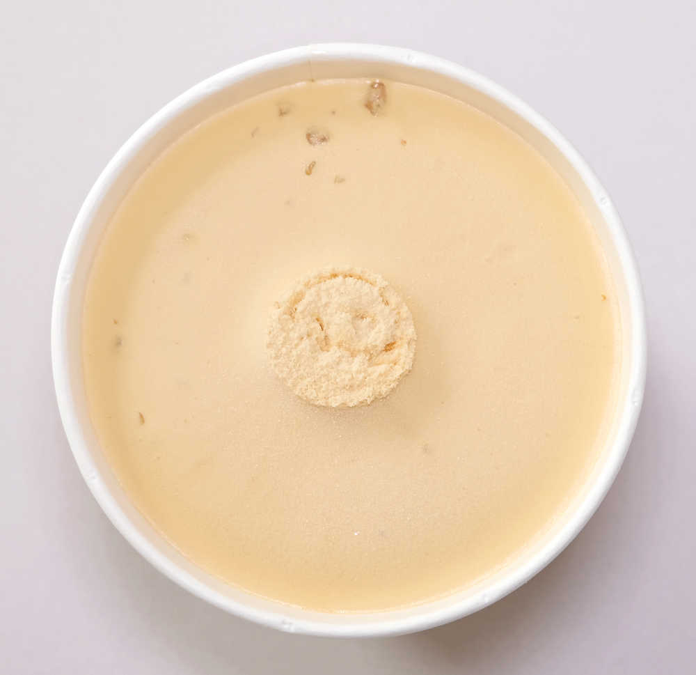 Top-down image of unscooped Kapiti caramel and cashew.