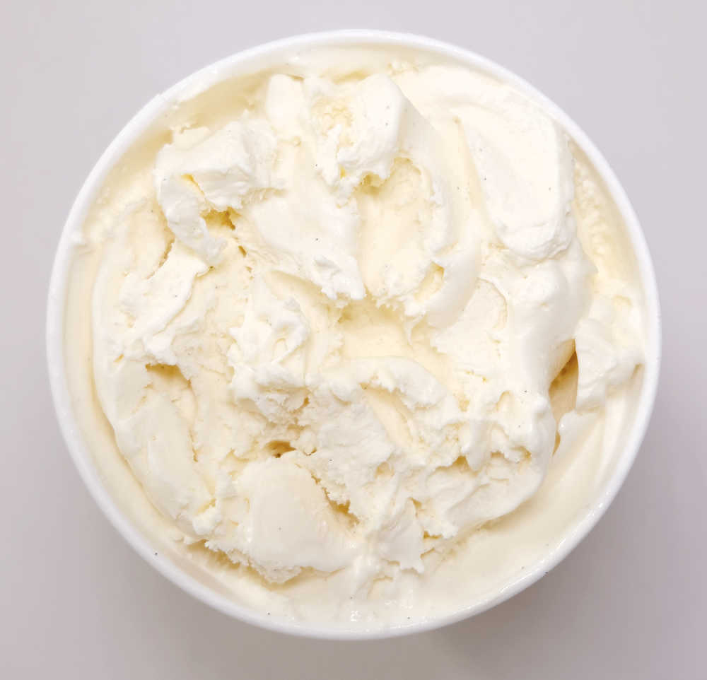 A partly eaten container of Vanilla Bean Ice Cream.