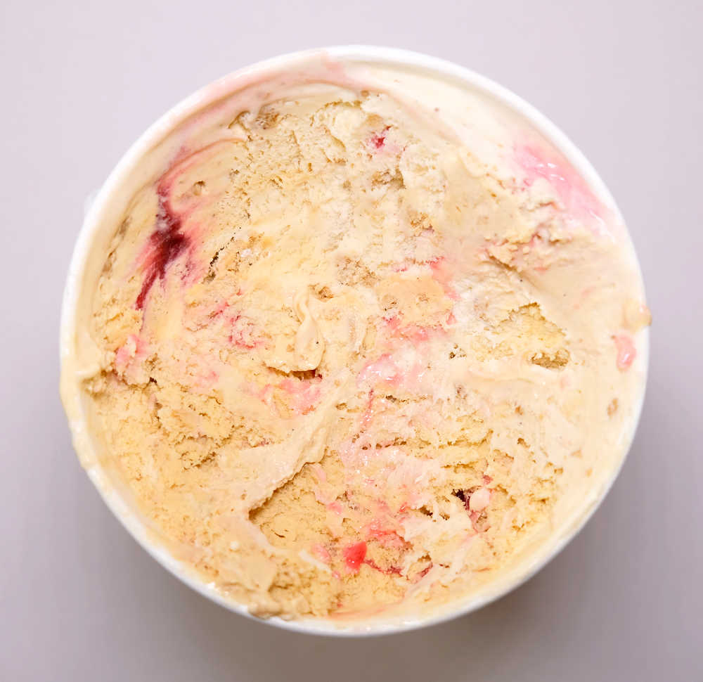 A bird's eye shot of Laneway Jam Doughnut ice cream in a container, partially eaten.