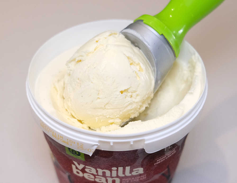 A closeup photo of a scoop of Woolworths Vanilla Bean Ice Cream.