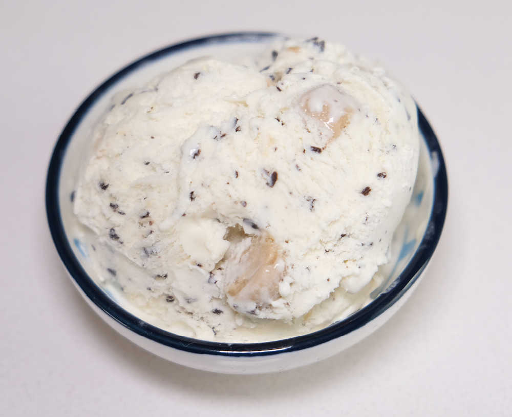 An isolated bowl of Cookie Dough Choc Flakes Ice Cream 473ml.