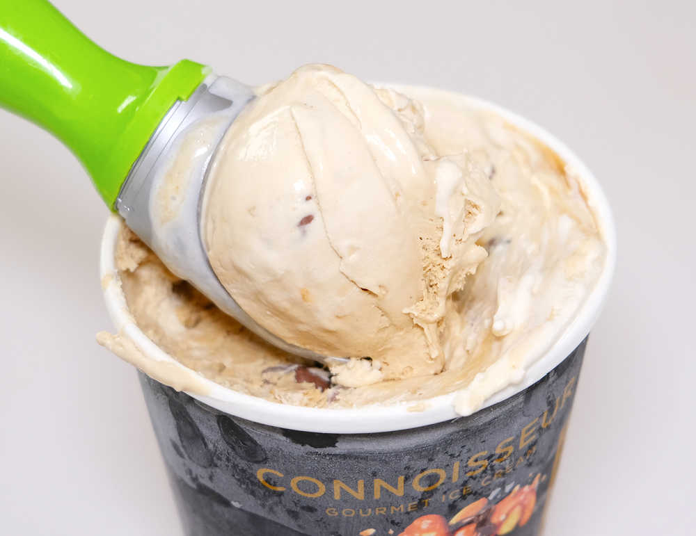 A scoop of Laneway Peanut Butter Ice cream resting on the container.