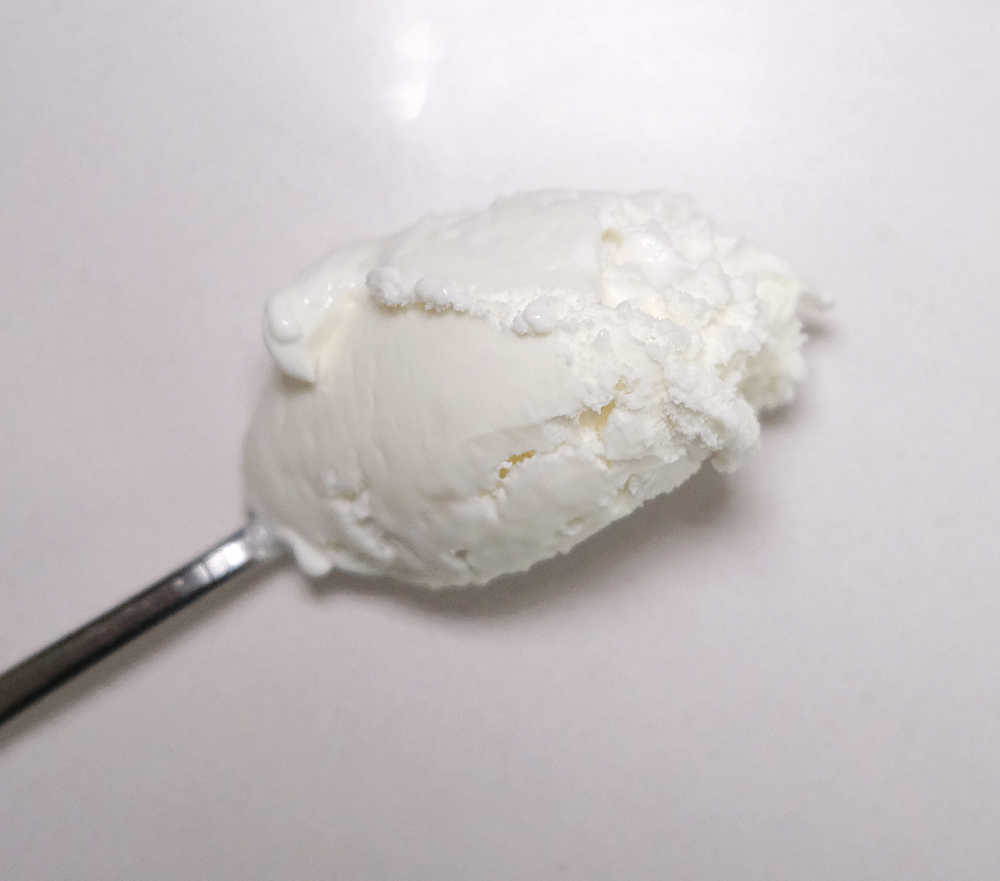 Closeup of a spoonful of Peters Original Vanilla.