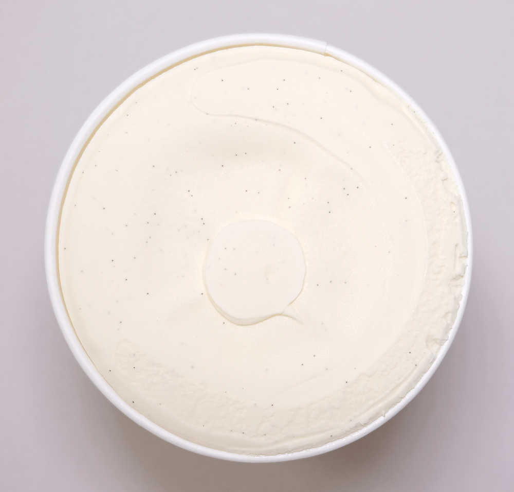 A top-down image of Coles Vanilla Bean Ice Cream ready to be scooped.