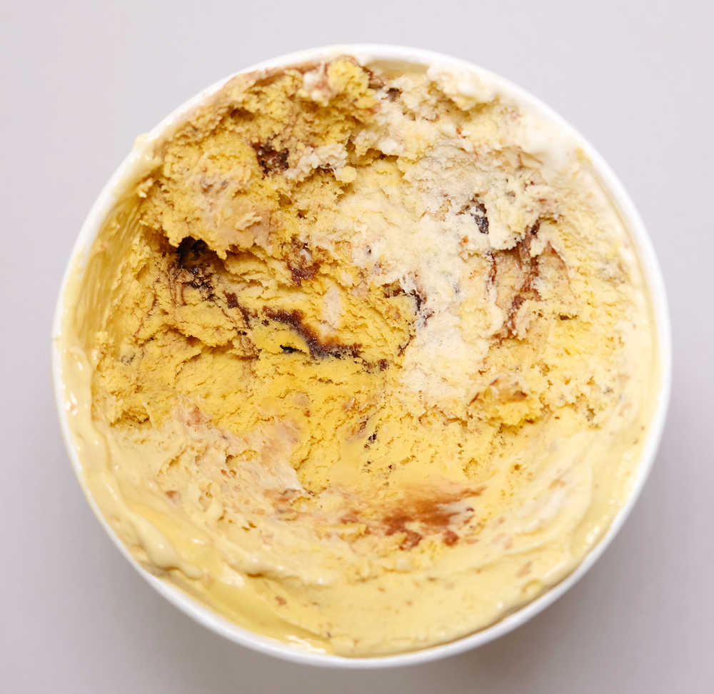 A bird's eye view of a partly eaten tub of Laneway Choc Chip Cookie ice cream..