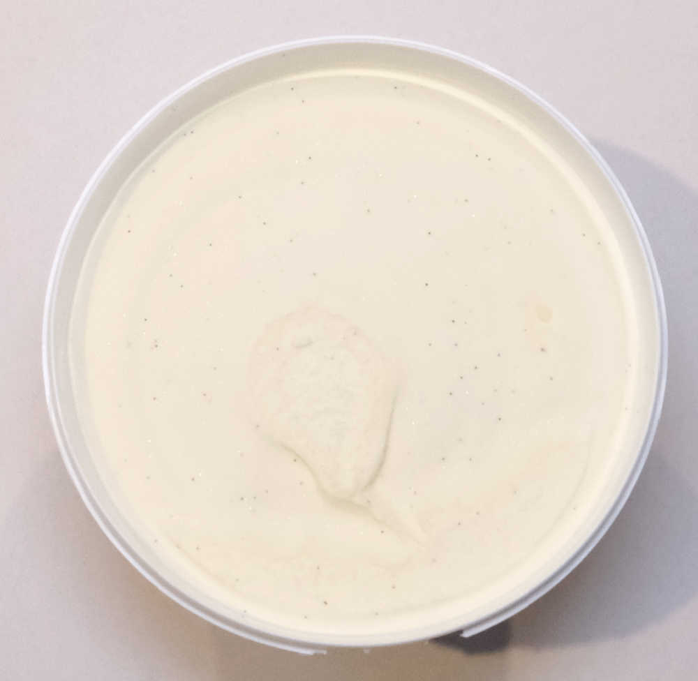 An unscooped pack of vanilla bean ice cream.