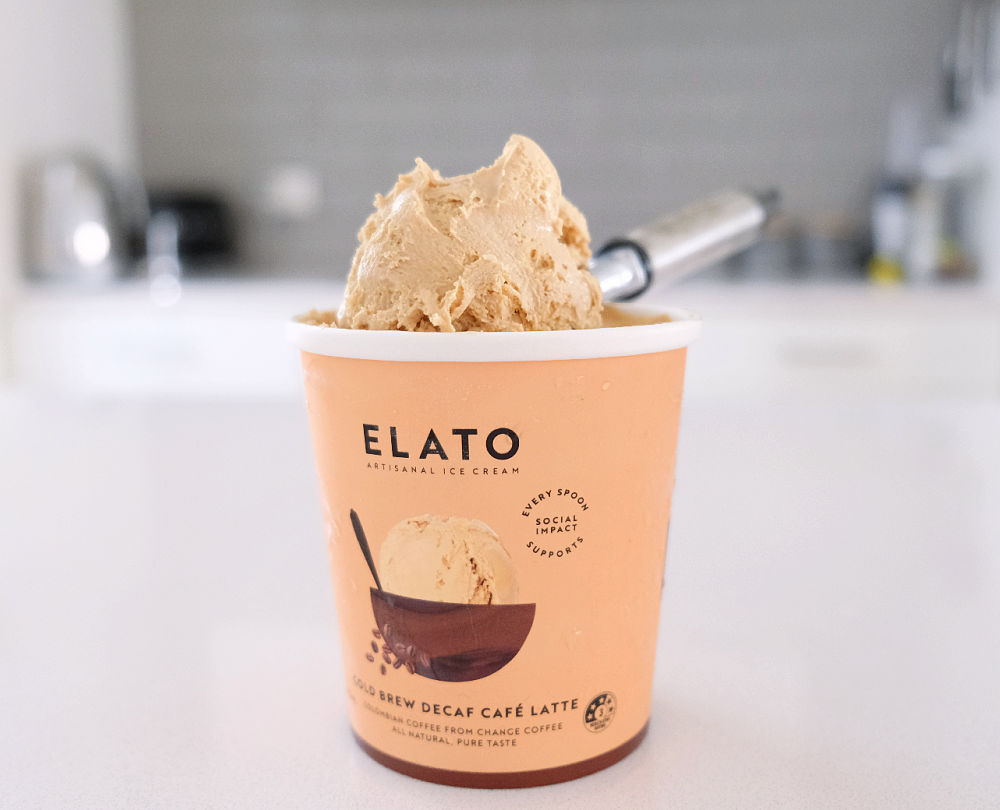 A scoop of Elato Cafe Latte Ice Cream sitting on the top of the tub.