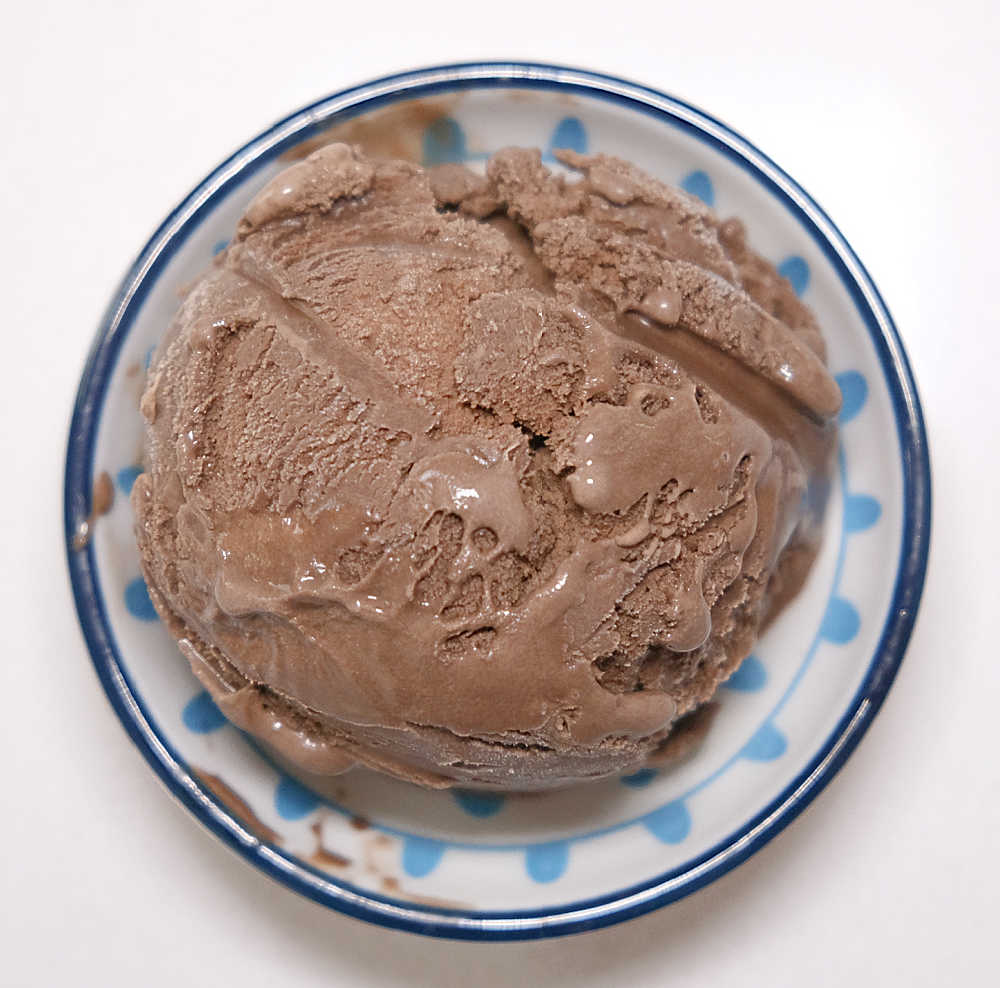 A bird's eye view of the ice cream in a small bowl.