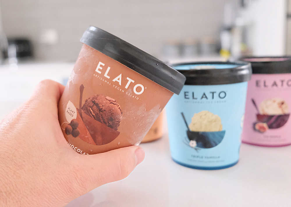 Holding a container of Elato Dark Chocolate Truffle Gelato.