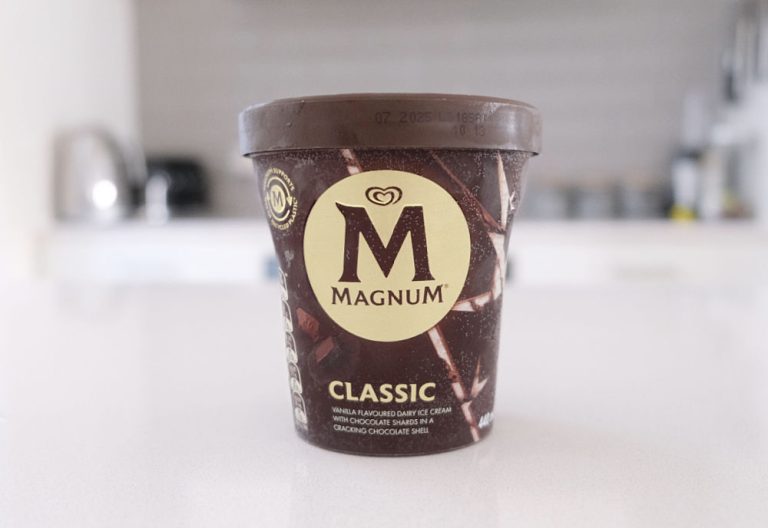 A tub of Magnum Classic Ice Cream sitting on the kitchen bench.