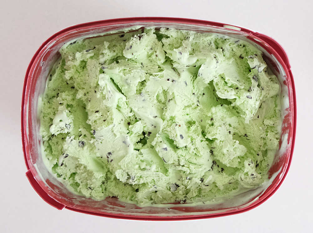 Bird's eye shot of a partially eaten container of Bulla Creamy Classics Mint.