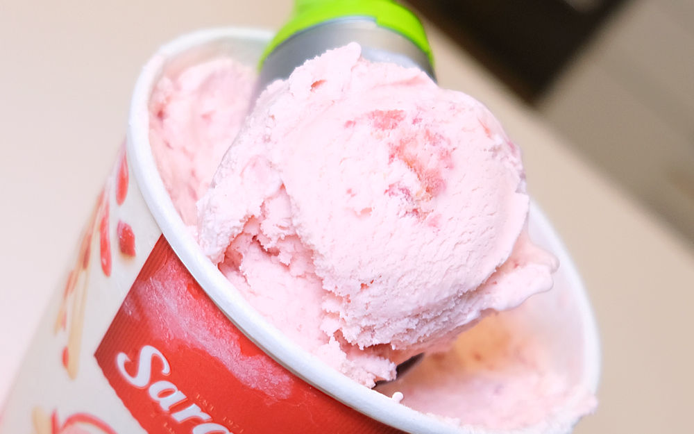 Closeup of a scoop of Sara Lee Strawberries and Cream Ice Cream.