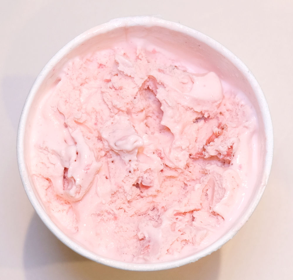 Top down photo showing the texture of Strawberries and Cream Ice Cream by Sara Lee.
