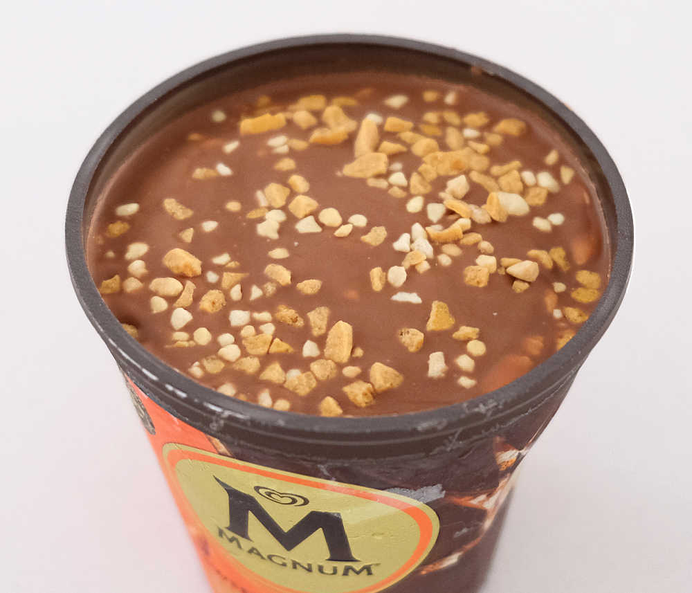 A close look at the top choc shell coating the Magnum Almond Remix ice cream 440ml.