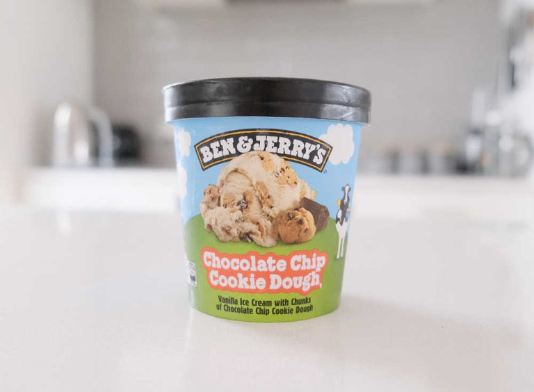 A pint of Ben & Jerry's Chocolate Chip Cookie Dough Ice Cream on the kitchen bench.