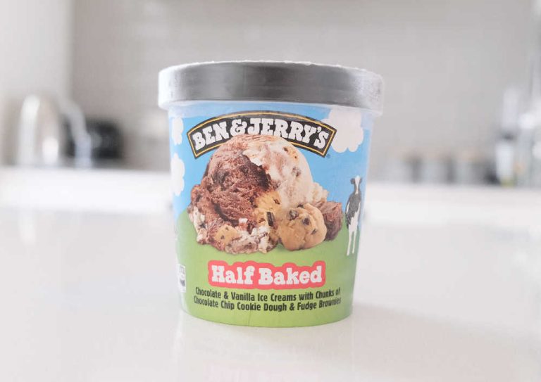 A pack of Ben & Jerry's Half Baked Ice Cream on a kitchen bench.