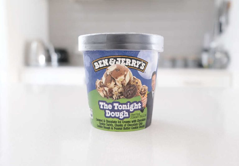 A pint of Ben & Jerry's The Tonight Dough sitting on a kitchen bench.